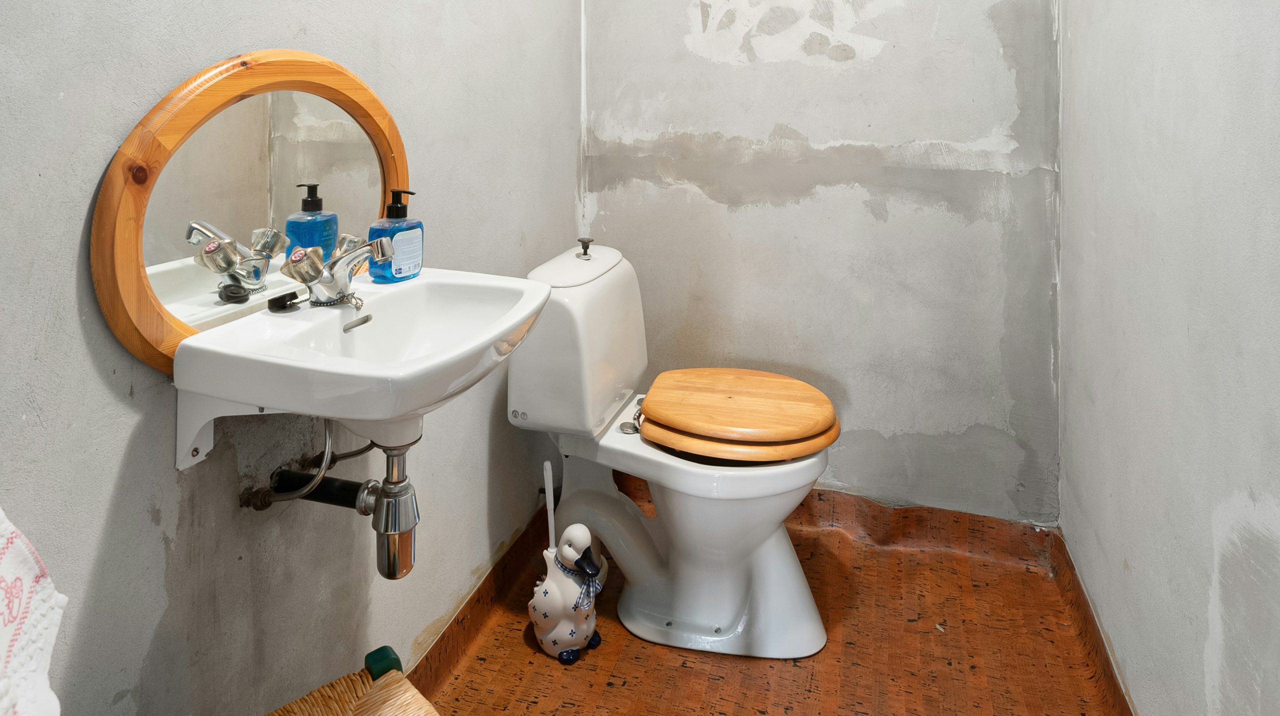 A bathroom that is falling apart because of a poor remodel.